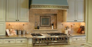 Kitchen remodeling projects detail of Jirsa family home. Custom tile backsplash and range hood.